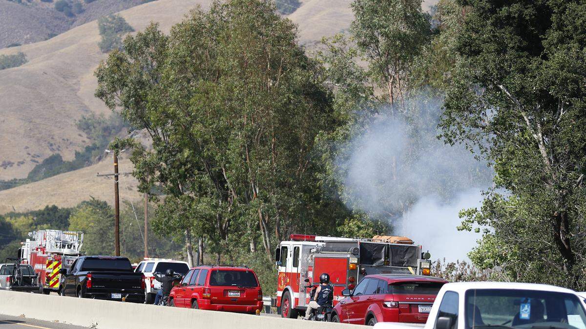 Traffic was backed up on northbound Highway 101 at Reservoir Canyon Road after a vegetation fire broke out Saturday, Aug. 14, 2021.
