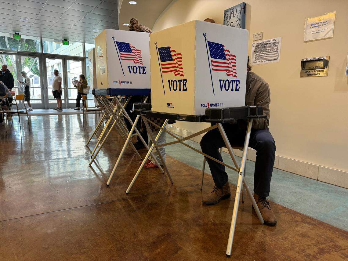Voters cast their ballots at the San Luis Obispo County elections office on Nov. 5, 2024.