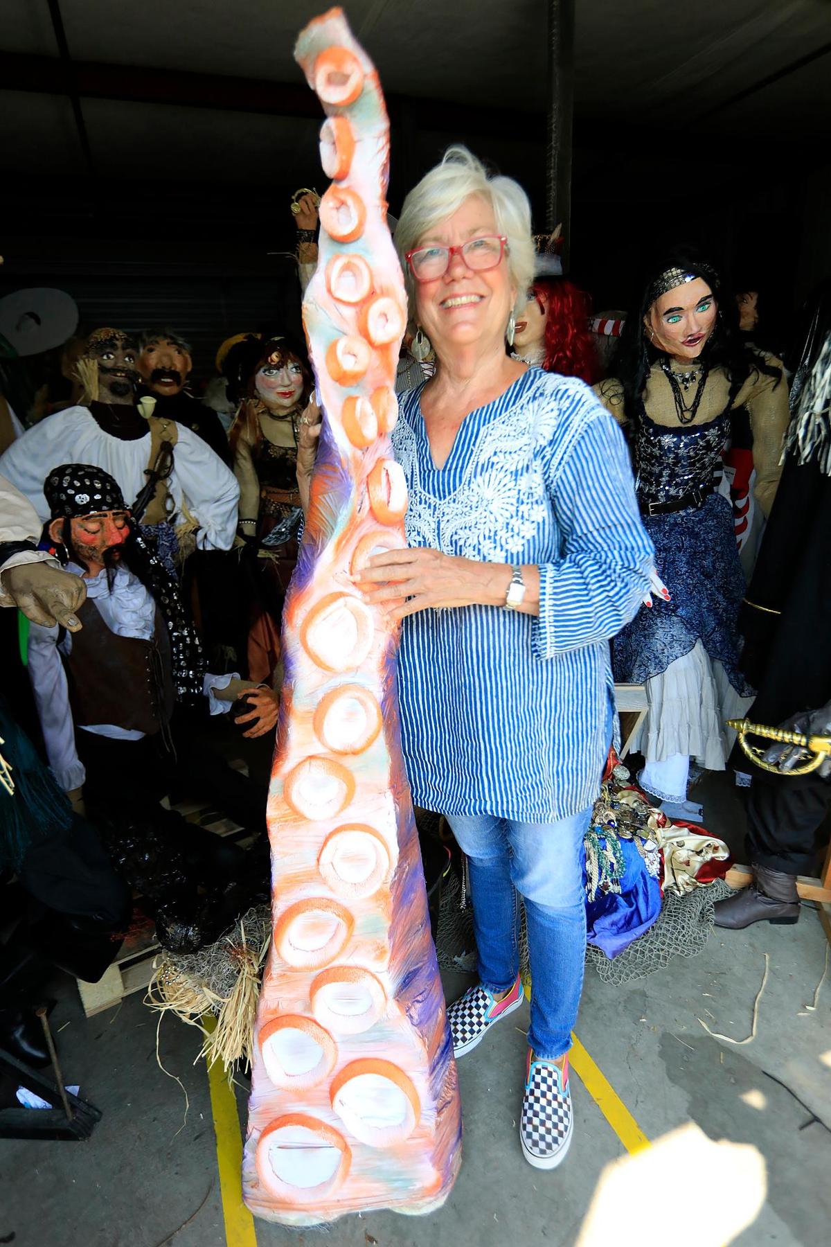 Chris Fischer, Cambria Festival volunteer coordinater, poses with a Kracken tentacle. The Cambria Scarecrow Festival will be held this year. The highlight will be a Pirate display featuring a pirate ship, a “kraken’ and treasure chest scene.