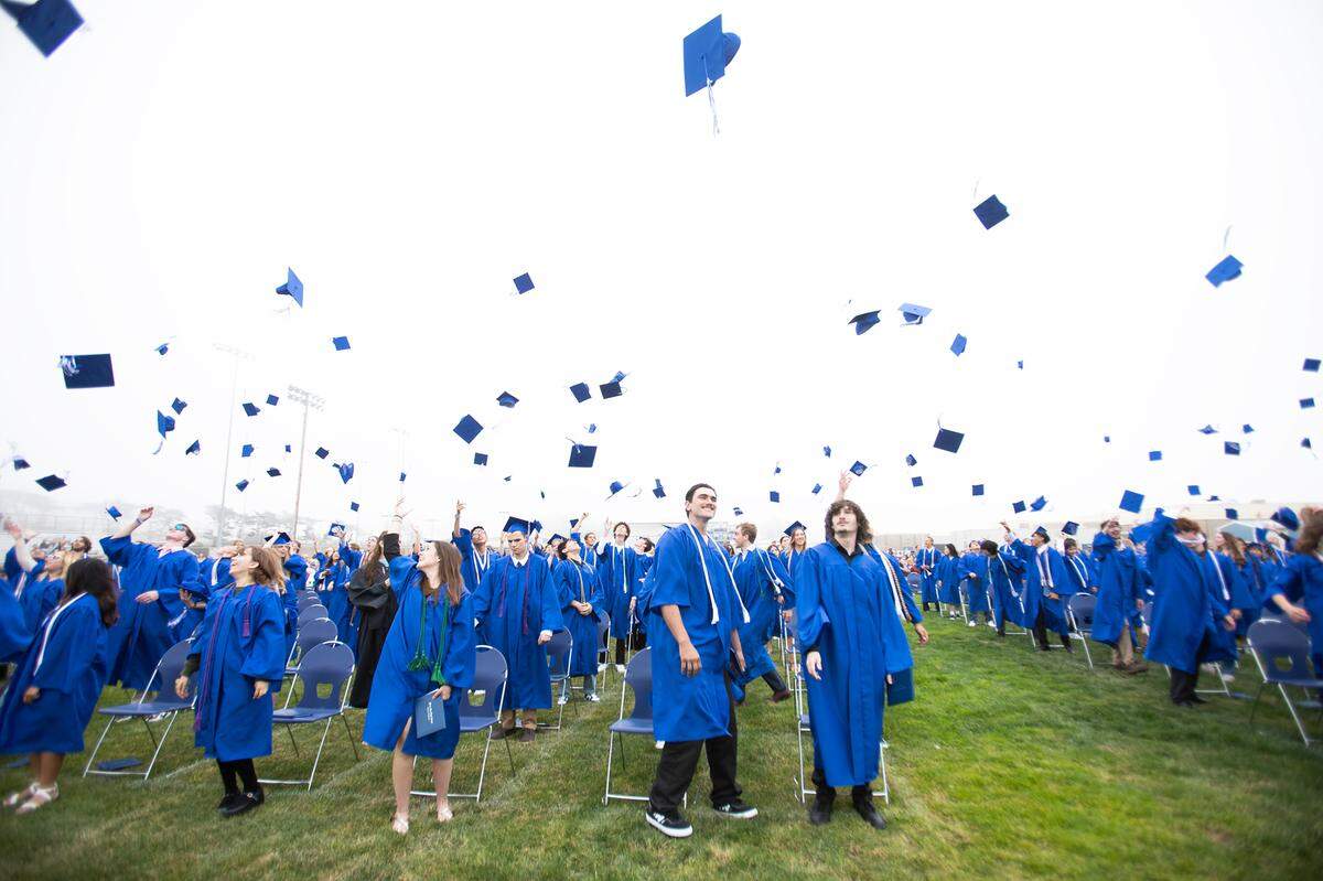 Morro Bay High School celebrated the accomplishments of its graduating Class of 2024 during a commencement ceremony on June 6, 2024.  Student graduates flip their hats in the air.