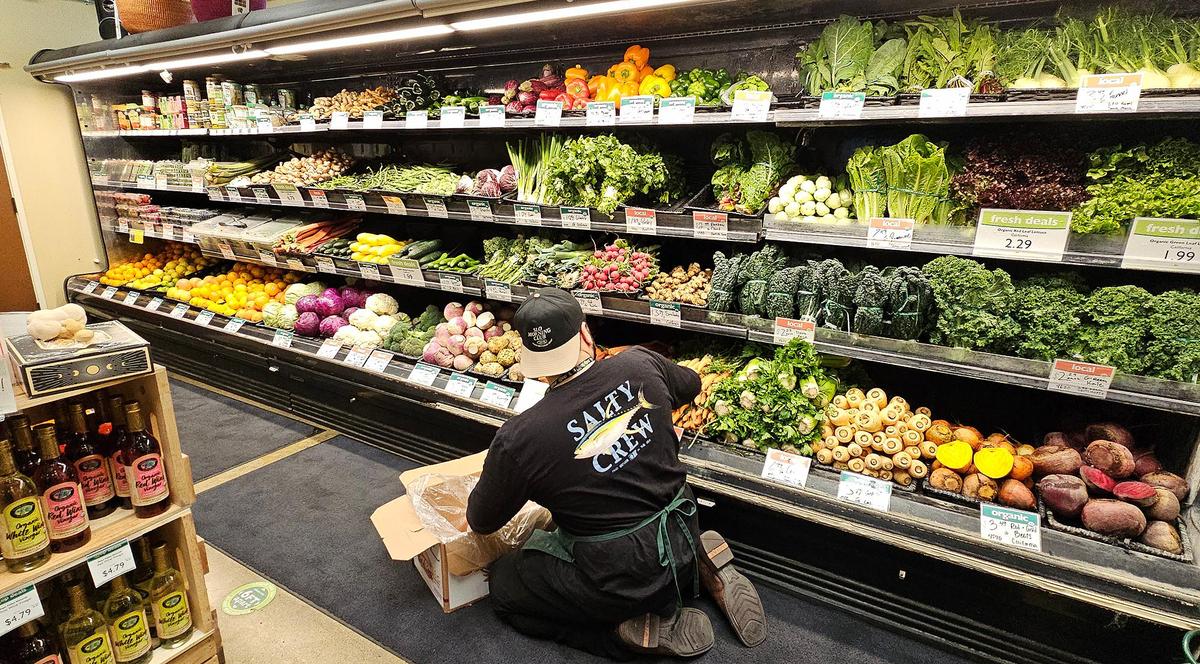 Produce manager, Josh Perez lines up the produce. The SLO Food Co-op (formerly known as the San Luis Obispo Natural Foods Co-op) has been serving the San Luis Obispo community since 1975 — so it’s been around for about 50 years.
