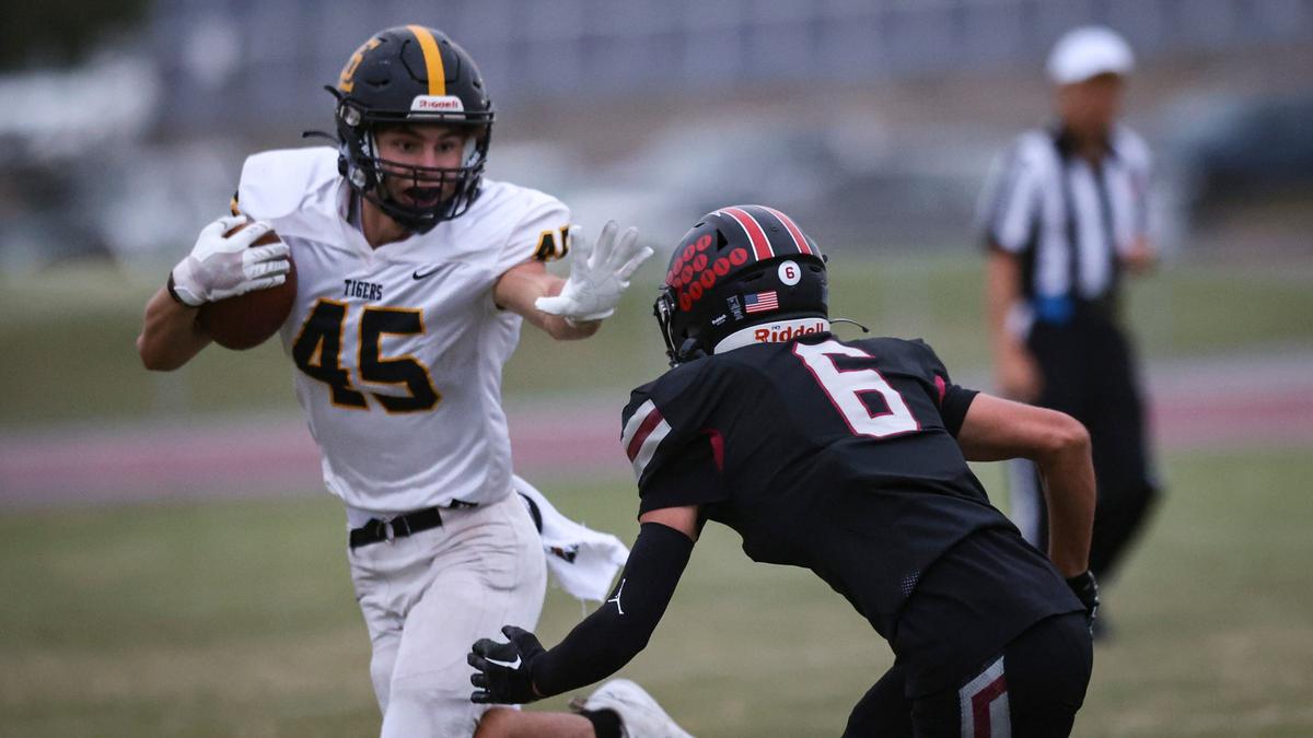 Colbin Garrison stiff arms Trevor Oxley. A PG&E power outage in Nipomo postponed the football game between San Luis Obispo High School and Nipomo after a scoreless first quarter on Sept. 13, 2024.