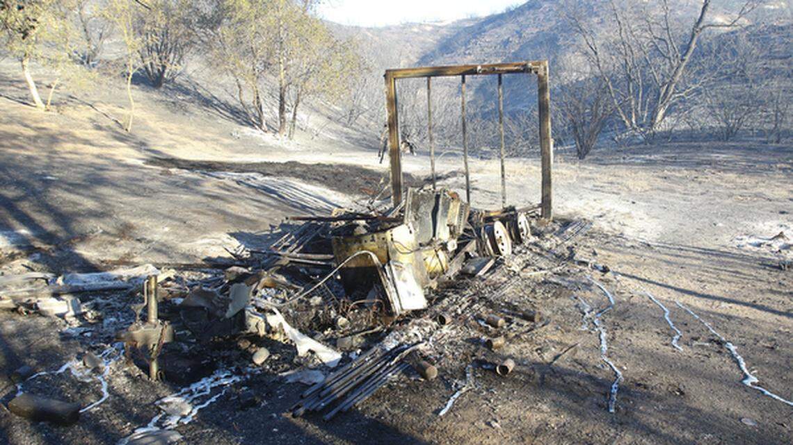 A trailer destroyed in the Parkhill Fire on Las Pilitas Road near Park Hill on Sunday morning.