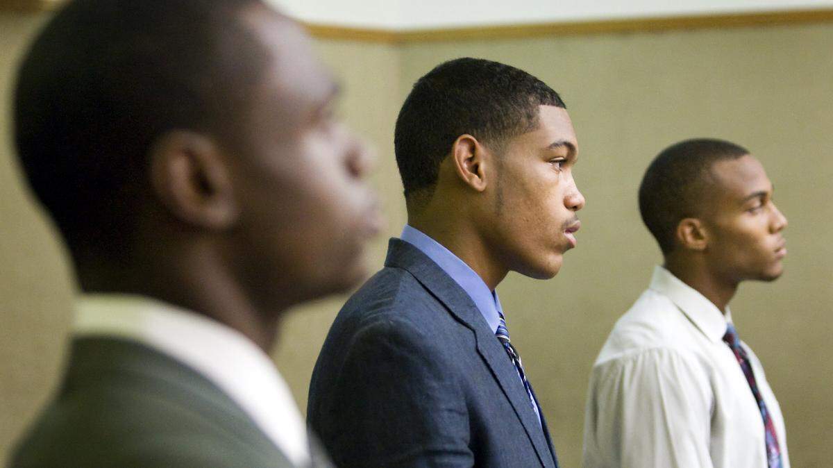 From left, Cortland Josiah Fort, Cameron Marcel Akins and Dominique Alize Love, three of five Cal Poly football players arrested in connection with an Aug. 10 attempted armed robbery at the Delta Sigma Phi fraternity house, appear in court Monday, Aug. 25, 2014, in San Luis Obispo.