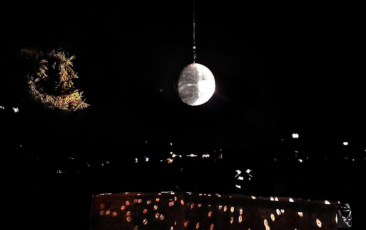 A crowd counts down as a disco ball is dropped during the city of Paso Robles’ first New Year’s Eve celebration in Downtown City Park on Saturday, Dec. 31, 2022.