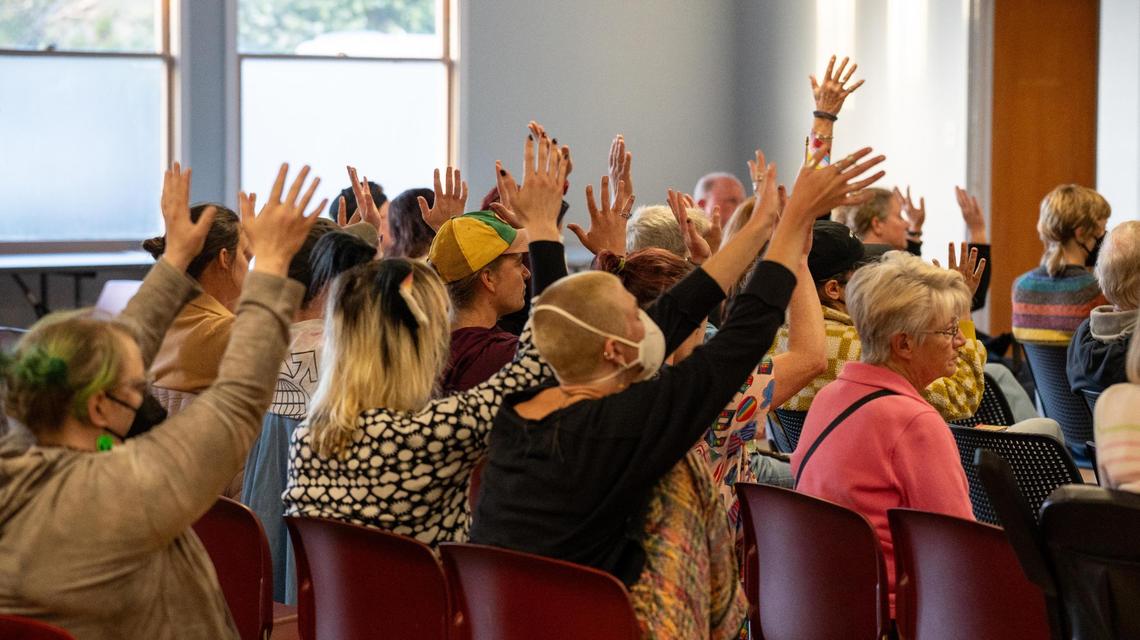 Onlookers wave Pride flags and cheer during the Morro Bay City Council meeting on Tuesday, May 14, 2022. Pride flags and other commemorative flags will not be flown over Morro Bay city buildings following 2025’s Pride month after the City Council voted to repeal a 2022 ordinance that allowed for commemorative flags to be flown.