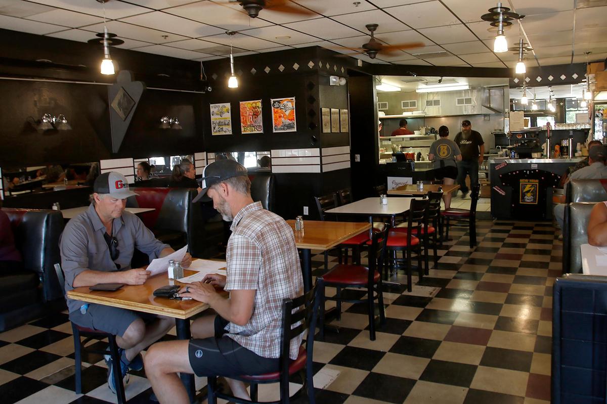 Jack Alger is owner of Mutiny Burger located at 1104 Pine St., Paso Robles on July 21, 2022. Customers peruse the menu in the eclectic-style restaurant.