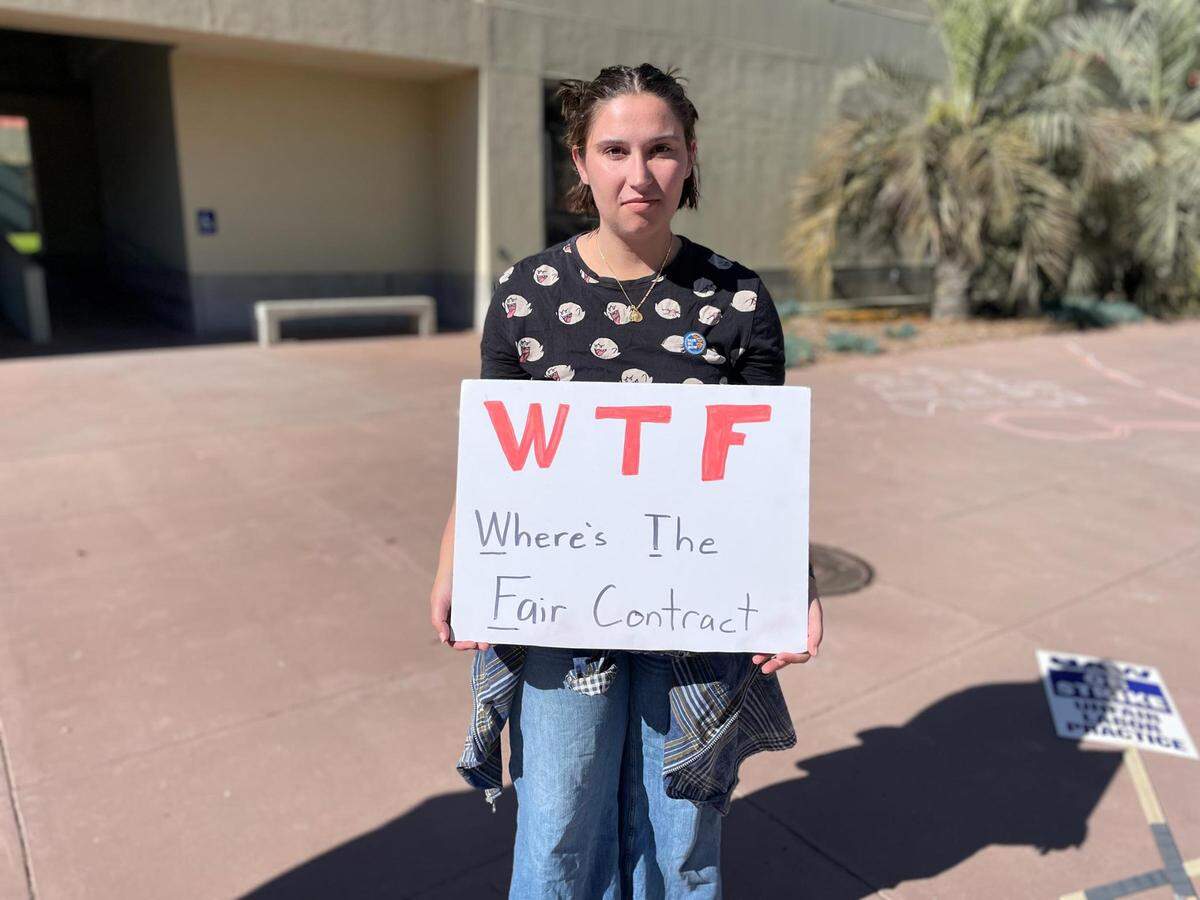 Madeline Vailhe holds a sign during the UAW strike on the UC Santa Barbara campus on Monday, Nov. 14, 2022.