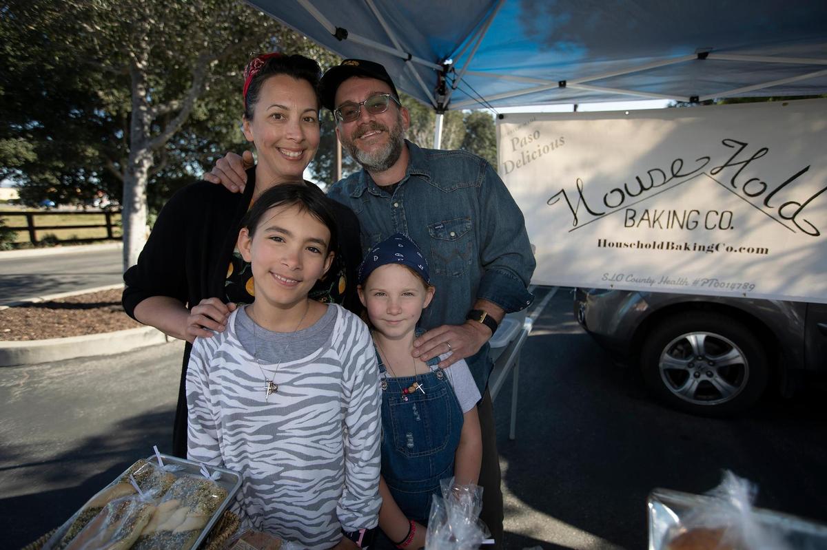 Dusty and Kristin Stewart of Household Baking Co. operate a cottage-industry bakery out of a tiny commercially licensed kitchen in a family cabin west of Paso Robles in Running Deer Ranch. Here, the Stewarts man their SLO Farmers Market booth with their children, Aubrey Bella, 10, and Lavinia “Lovey” Rose, 8.
