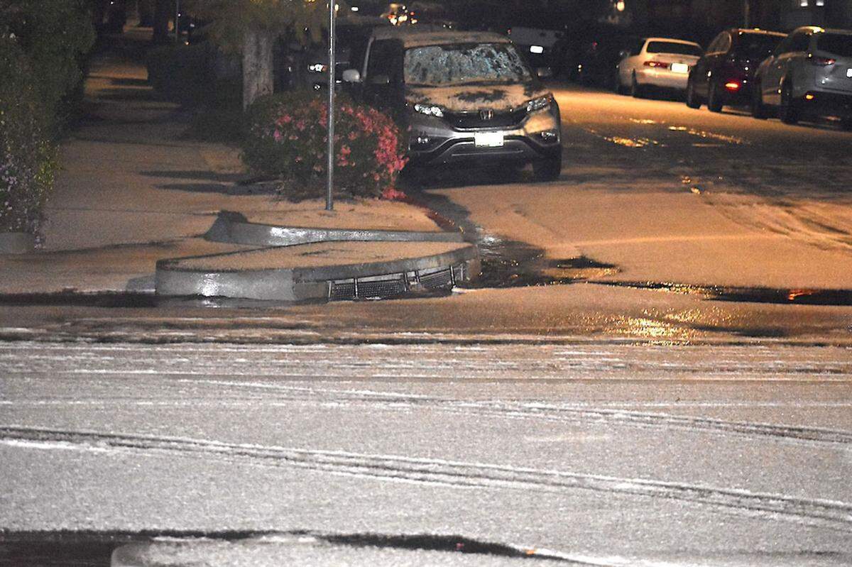 Hail blankets Sola Street in downtown Santa Barbara on Wednesday night. The late-winter storm dropped only modest amounts of rain in most areas of Santa Barbara County.