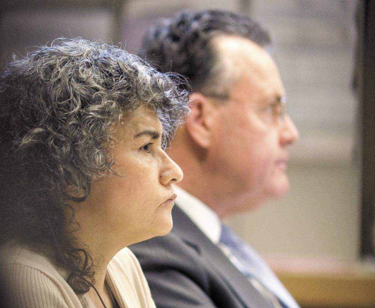 Maria del Carmen Granados Fajardo, 51, sits next to her attorney, Paul Phillips in San Luis Obispo Superior Court on Monday, Nov. 17, 2014. She was convicted and sentenced to 21 years in prison for her role in the murder-for-hire of Victor Hugo Sanchez.