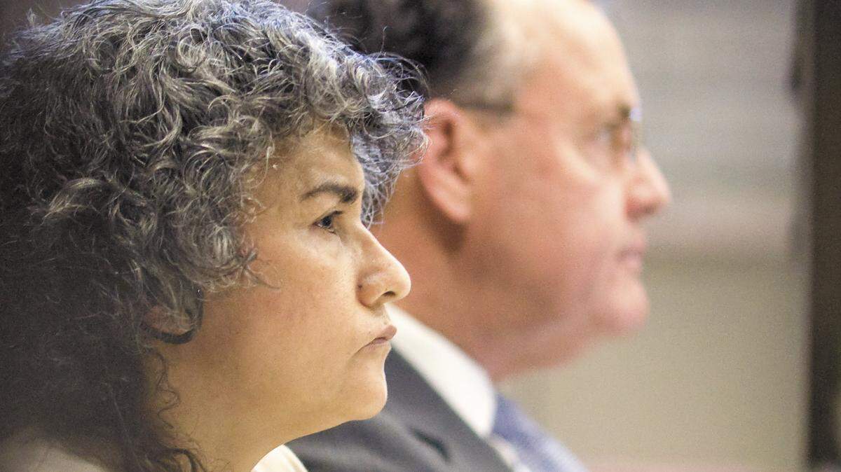 Maria del Carmen Granados Fajardo, 51, sits next to her attorney, Paul Phillips in San Luis Obispo Superior Court on Monday, Nov. 17, 2014. She was convicted and sentenced to 21 years in prison for her role in the murder-for-hire of Victor Hugo Sanchez.