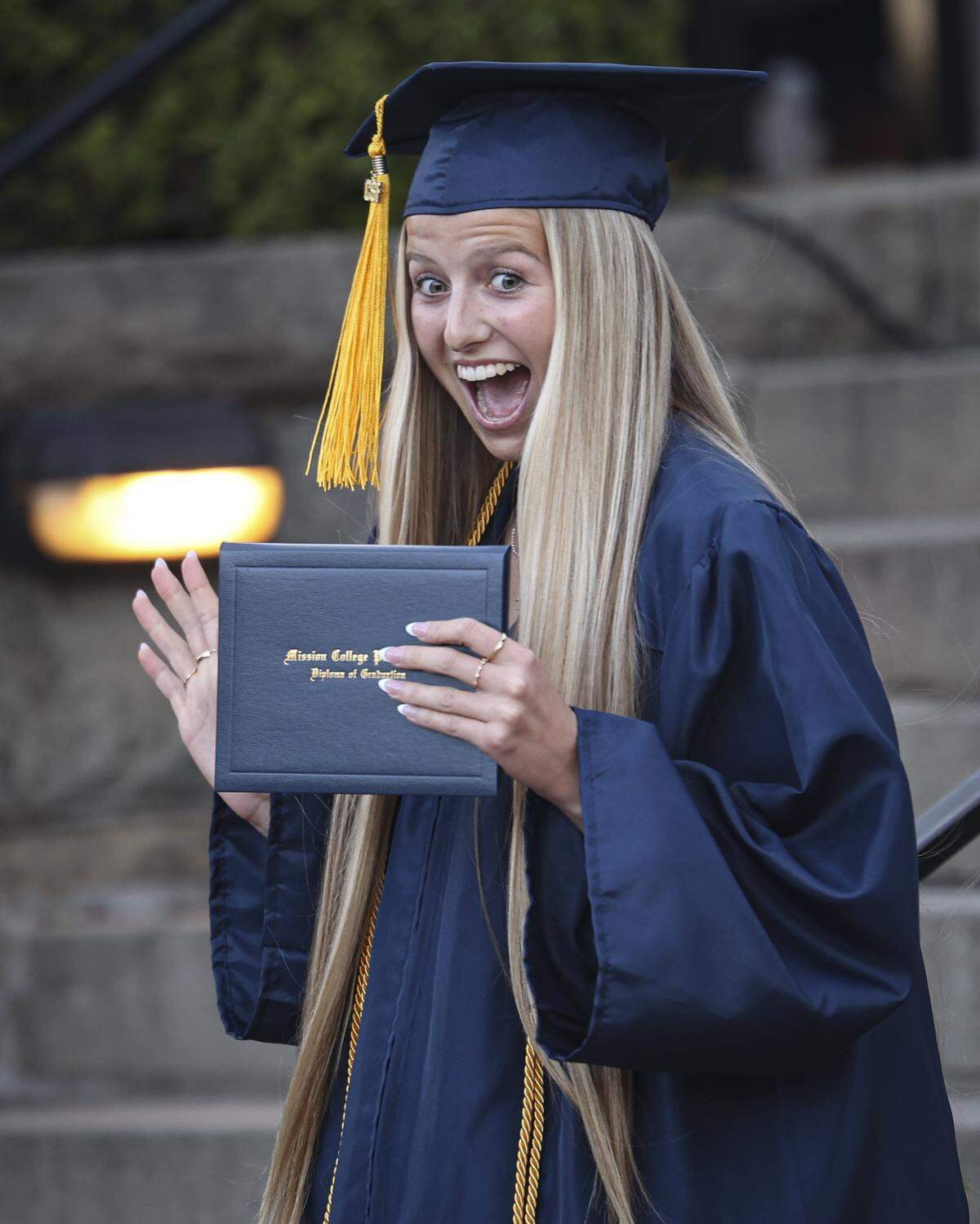 Addison Blake waves and smiles to the crowd after getting her diploma. Mission Prep graduated 66 students in a ceremony at Old Mission San Luis Obispo on May 29, 2026.