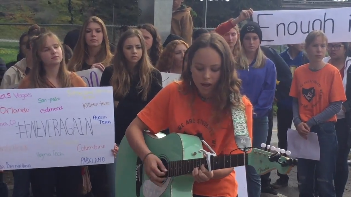 Amalia Fleming performs a protest song at Morro Bay High School during a national walkout against gun violence in 2018.