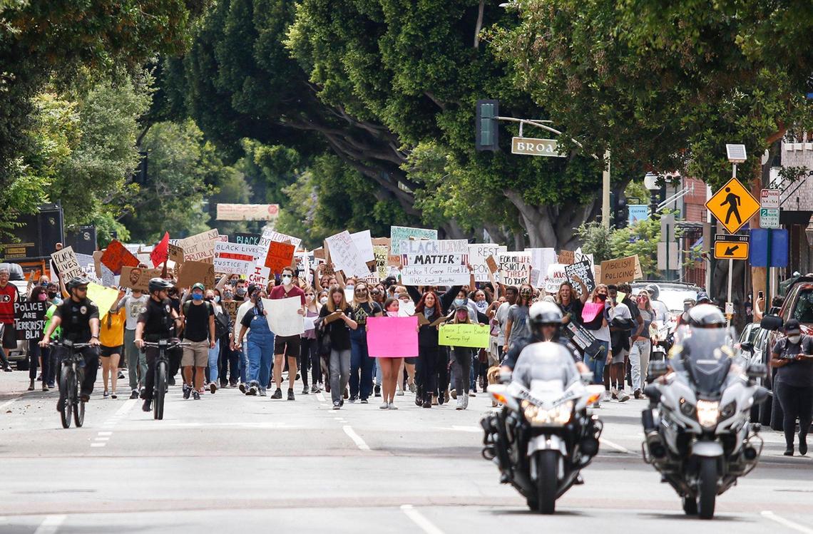 The Black Lives Matters marchers travel east on Marsh Street as San Luis Obispo police officers assist with traffic control on Sunday, May 31, 2020.