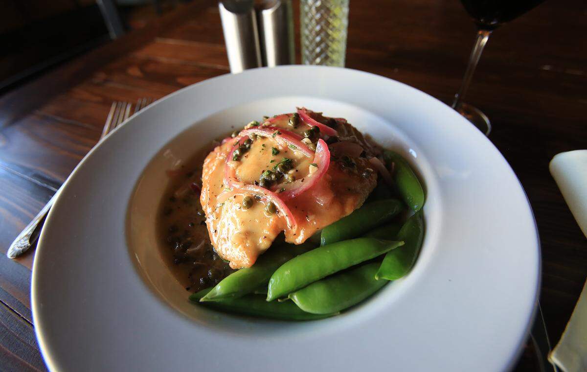 Café della Via’s chicken picatta features flavors of white wine, lemon, butter, red onion and capers, served with seasonal vegetables, garlic mashed potatoes or pasta.