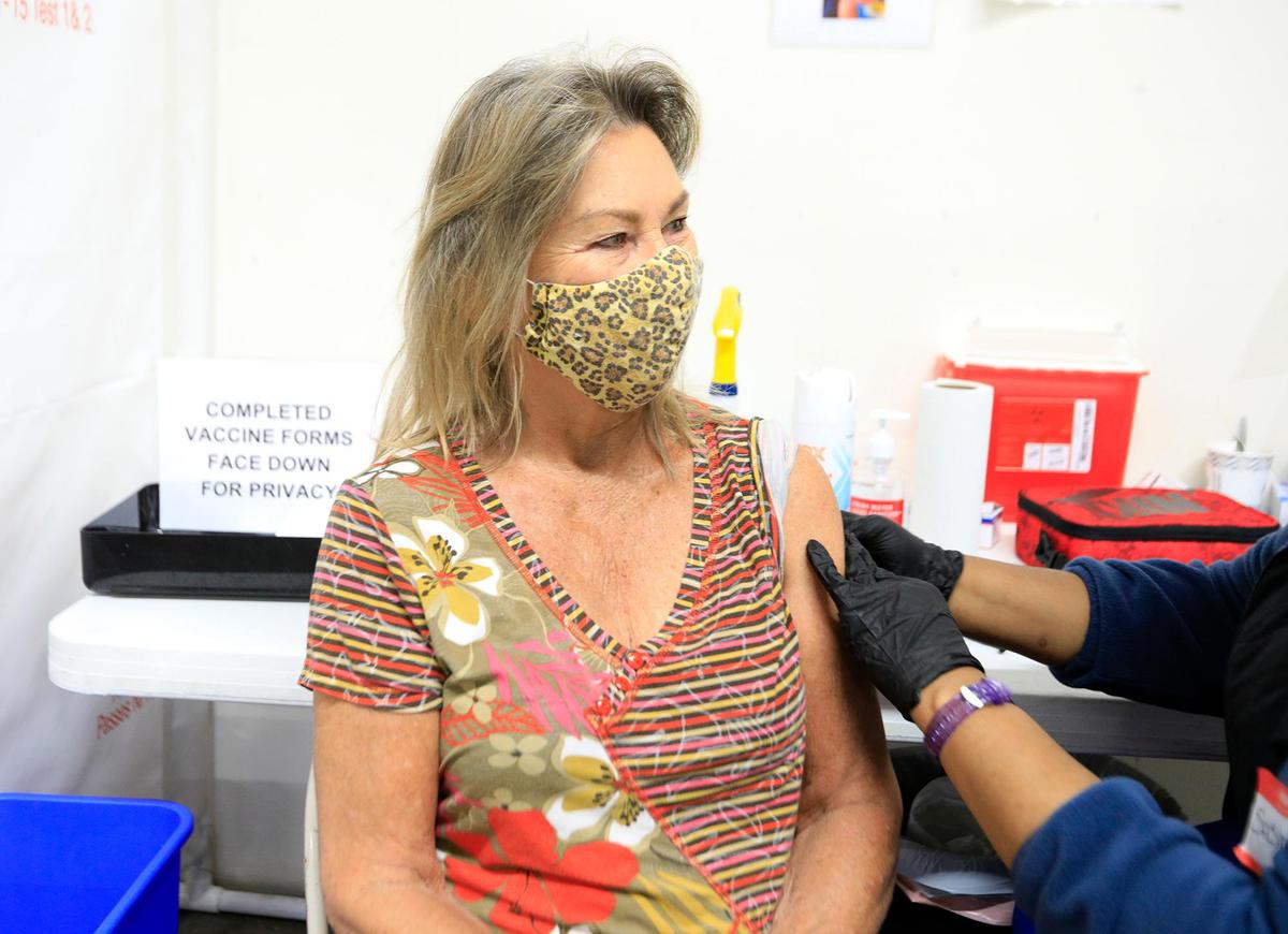 Susan Brownlee of Paso Robles receives her first COVID-19 shot at a coronavirus vaccination site at Paso Robles Event Center. It’s run by the San Luis Obispo County Public Health Department.