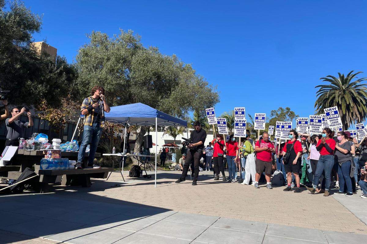 Joe Costello, a physics graduate student and organizer with Student Researchers United, speaks to a crowd on Monday, Nov. 14, 2022, the first day of a strike at UC Santa Barbara.