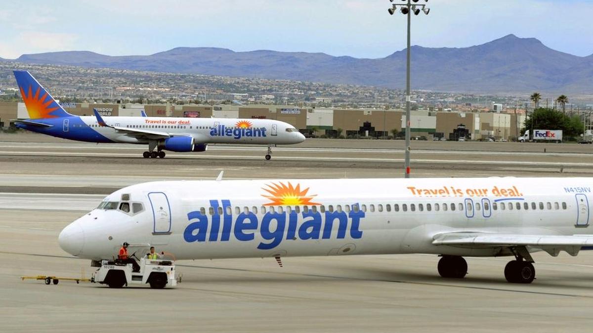 In this May 9, 2013, file photo, two Allegiant Air jets taxi at McCarran International Airport in Las Vegas. Shares of Allegiant Air’s parent company were tumbling in Monday, April 16, 2018, premarket trading following a “60 Minutes” investigation that expressed serious safety concerns about the airline.