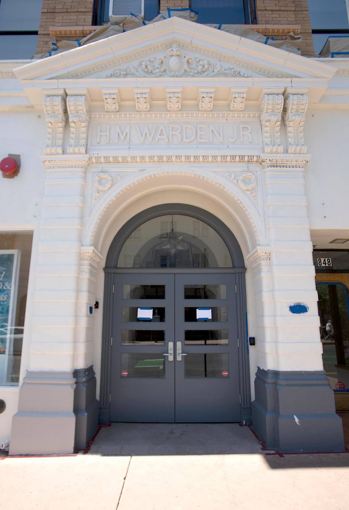 San Luis Obispo’s historic Warden Building on Higuera Street — home to Bath & Body Works — is being painted white, much to the concern for some residents.