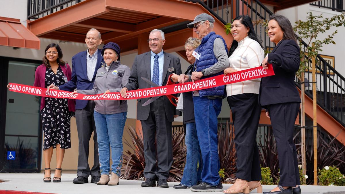 People’s Self-Help Housing board members and Pismo Beach city government officials cut the ribbon at the grand opening of Pismo Terrace, a 50-unit affordable housing complex at the intersection of North 4th Street and 5 Cities Drive, on Wednesday, Sept. 18, 2024.