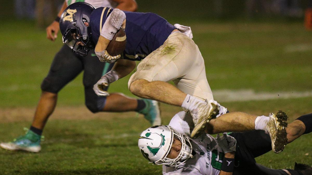 Cole Tanner dives for yardage. Mission Prep fell to St. Joseph 49-21 on Oct. 28, 2022, in the last game of the regular season, giving the Knights the Mountain League football championship.