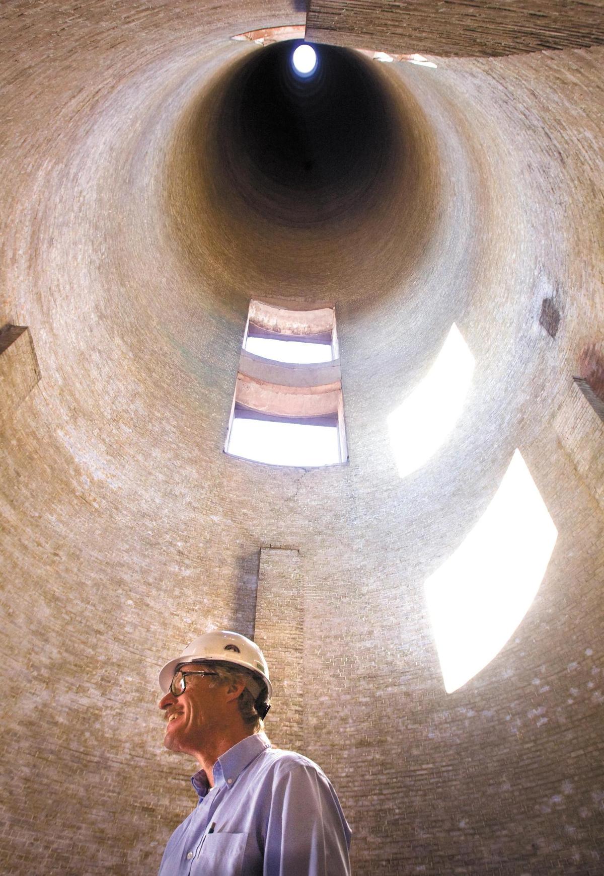 Plant manager Steven Goschke stands inside the 450 foot tall smokestack 1 at the Morro Bay Power Plant on the last day the facility was available for electric power generation in 2014.