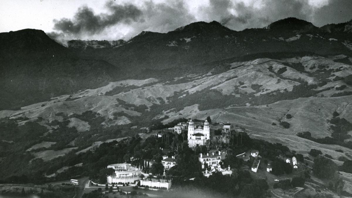 An undated aerial photograph of Hearst Castle as clouds form over Santa Lucia Range.