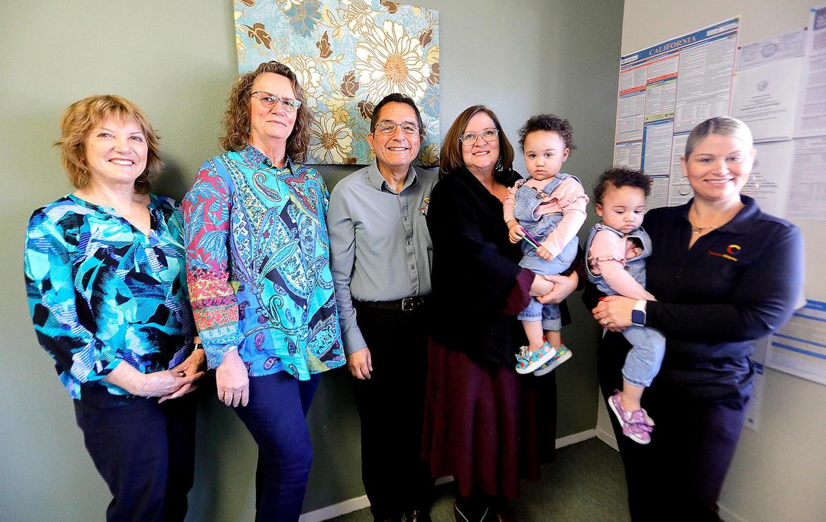 Ron and Maria Torres co-founded the Paso Robles location of Seniors Helping Seniors. From left, caregivers Elaine McElmury, Brenda Schoennauer, Ron and Maria Torres’, Natalie Hale with twins Mya and Mia, age 2.