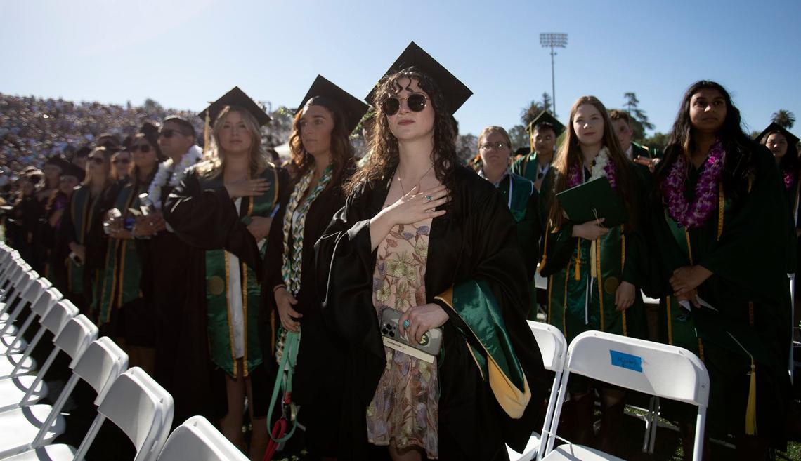 Cal Poly kicked off graduation weekend with three ceremonies on June 15, 2024. The university expects to celebrate more than 6,300 graduates throughout the weekend. Graduating student held their chests to the pledge of allegience.