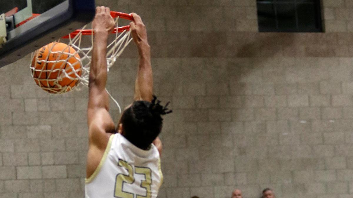 Mission Prep’s Jamar Howard (23) dunks the basketball. The Mission Prep boys basketball team beat Bullard High School 66-50 in a first-round playoff game in San Luis Obispo, Feb. 15, 2023.