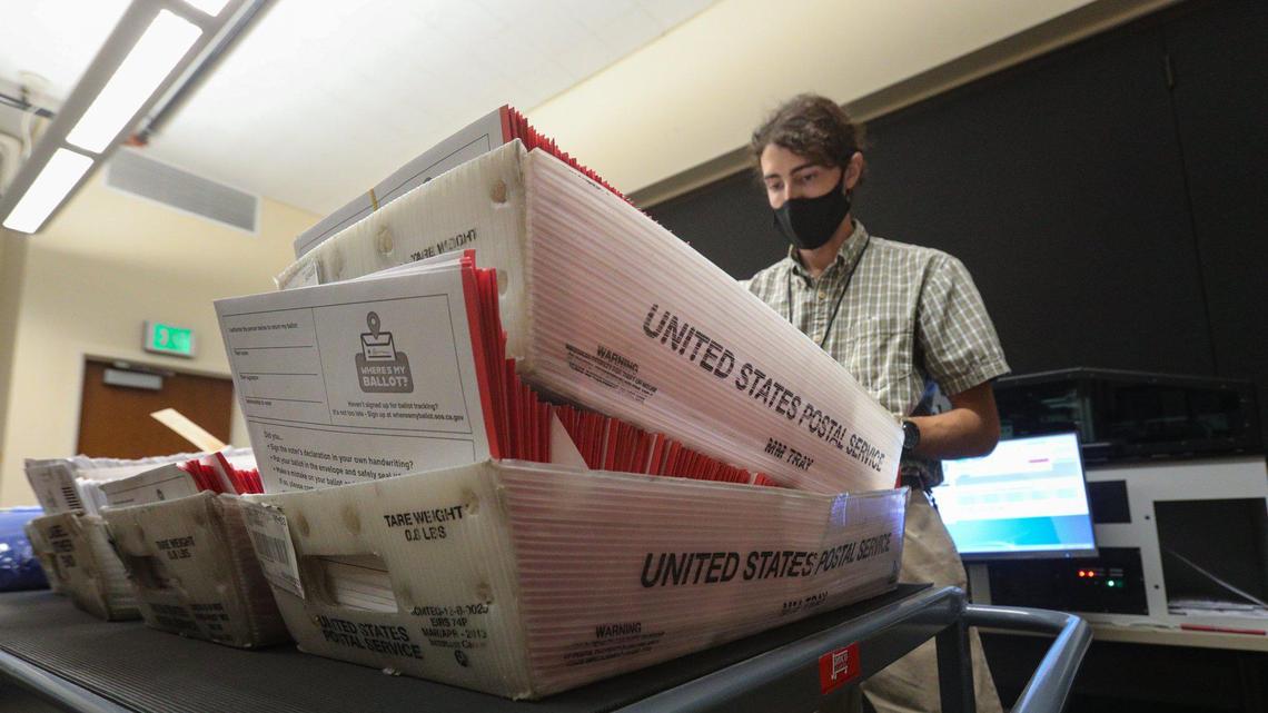 Eric Johnson, temporary election assistant, conducts one of the first steps in the ballot-handling process: Envelopes are photographed individually by machine. The San Luis Obispo County Clerk Recorder’s Office has already received more than 47,000 ballots back from voters, roughly a quarter of all possible voters. Clerk-Recorder Tommy Gong calls this an “election for the ages.”