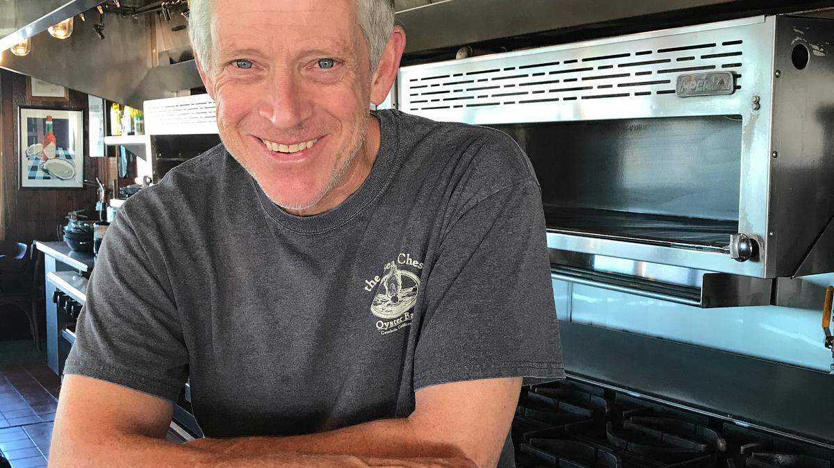 Steve Kniffen pauses in the kitchen of a restaurant in which he’s worked for 37 years, an iconic, oceanview seafood dinner house that he now owns, the Sea Chest Oyster Bar in Cambria.