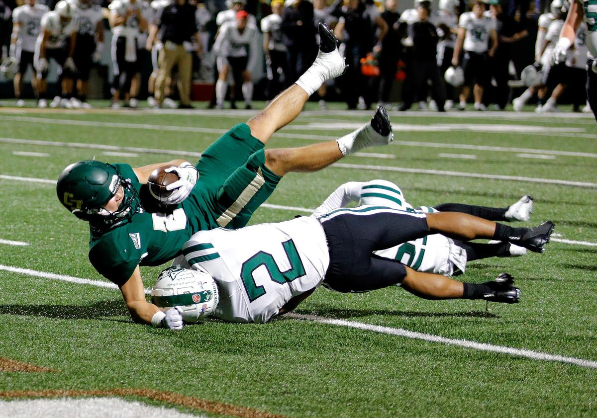 Mustang Troy Fletcher (28) scores a touchdown. Cal Poly beat Portland State 49-42 to earn their first and only Big Sky win of the season on Saturday, Nov. 19, 2022, at Alex G Spanos Stadium in San Luis Obispo.