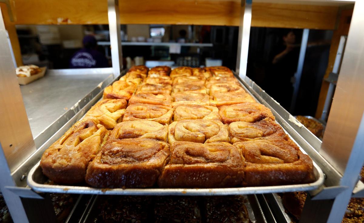 A fresh batch of cinnamon rolls comes out of the oven at Old West Cinnamon Rolls in Pismo Beach.