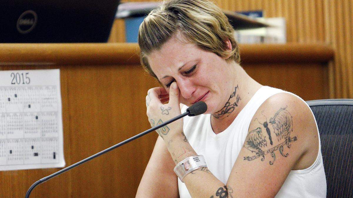 Ashley Moss cries during her testimony Wednesday, Sept. 9, 2015, during Thomas Yanaga's murder trial.