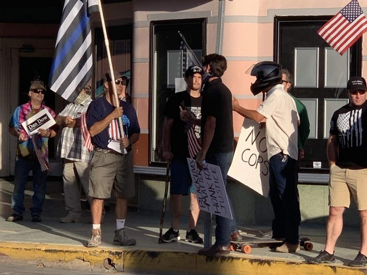 Two Black Lives Matter protesters countered an Aug. 27, 2020, “Back the Blue” rally on Monterey Street in San Luis Obispo and were quickly swarmed and drowned out to chants of “USA! USA!”