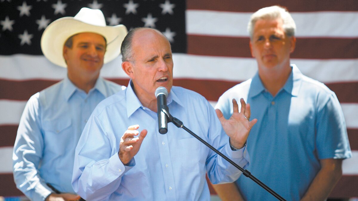 Rudy Giuliani speaks during a campaign stop in Santa Margarita on Sunday, June 11, 2007. At left, is Sam Blakeslee, and at right is Kevin McCarthy.