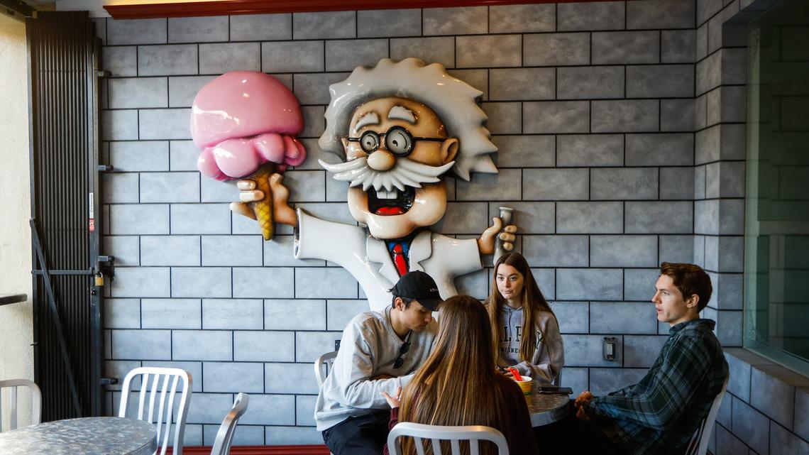 Cal Poly students enjoy a treat at Doc Burnstein’s Ice Cream Lab in San Luis Obispo in 2019. An eviction notice was posted on the door of the parlor in January 2023.