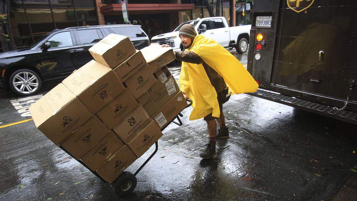 Julian Ortiz had a UPS truck filled with packages to deliver including these to Barnes & Noble on Morro St. Downtown San Luis Obispo as storm arrives on Christmas Eve Dec. 24, 2025.