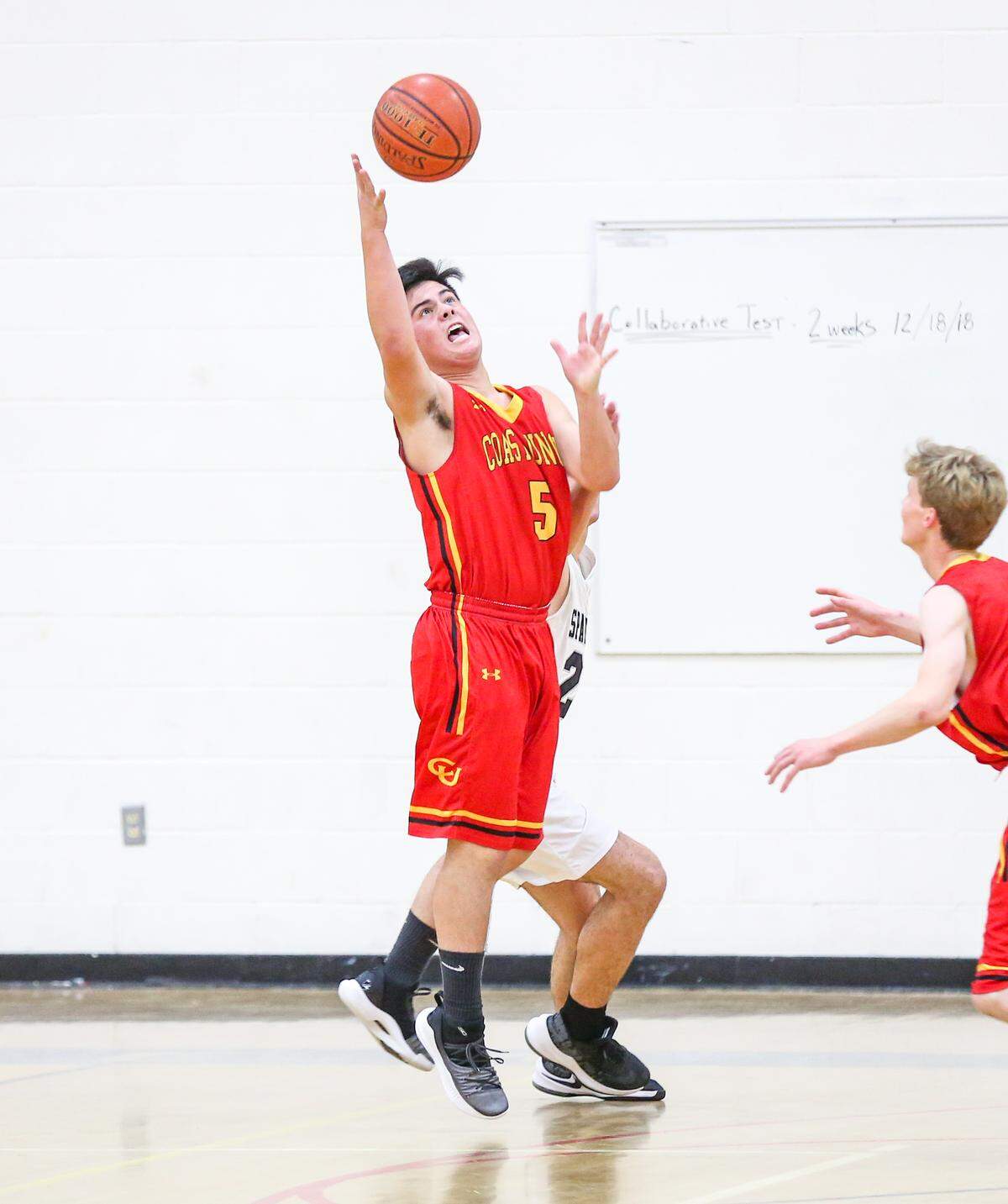 Senior center David May has 95 rebounds through the team’s first 20 games; he has 28 steals and leads the Broncos with eight blocked shots. Here he defends the Coast Union basket in an earlier game this season.