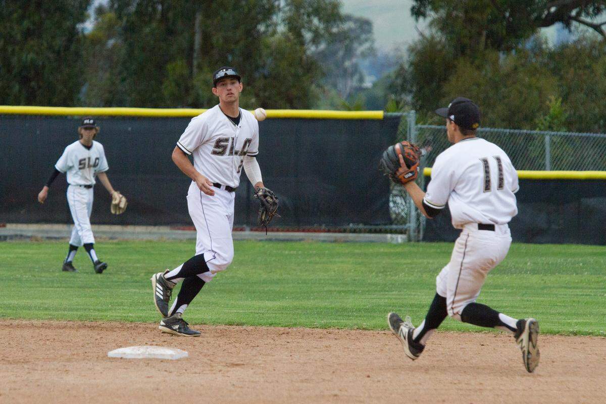 Brooks Lee flips the ball to Wils Guy (11) to start a double play during San Luis Obispo’s 8-4 CIF Central Section Division I playoff game against Western Tulare. Lee is a top 50 prospect in the upcoming MLB Draft and is committed to Cal Poly.