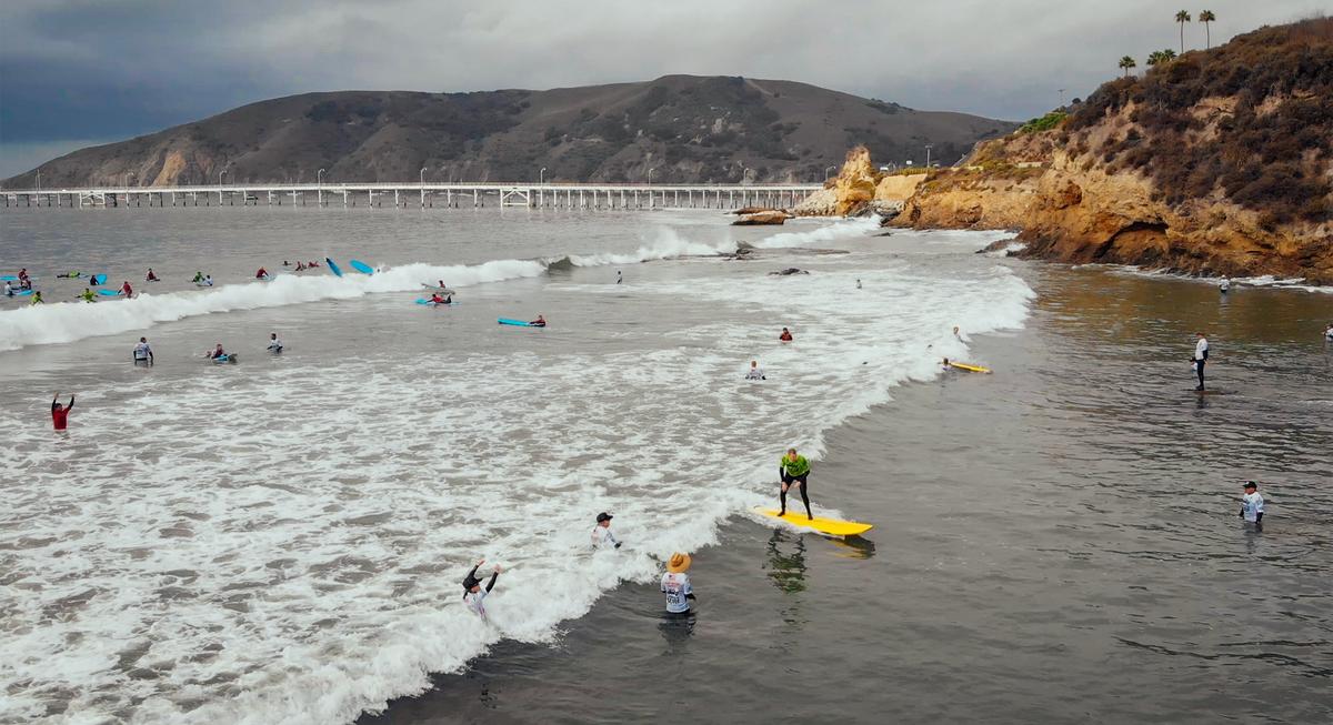 A participant rides the surf in Avila Beach during Operation Surf, a week-long program for wounded-veterans and active-duty military.