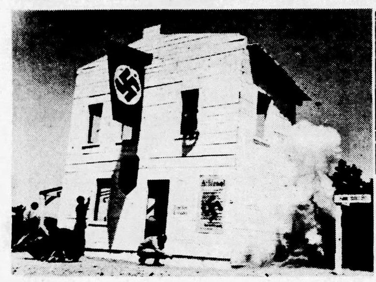 Photo shows Nazi training village at Camp Roberts. Smoke is from a building from which a hidden charge is detonated to train defusing booby traps. Published May 30, 1944.