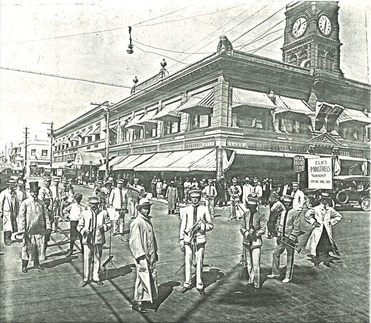 A band is photographed in front of the H.M Warden or Tower Building on Higuera Street in downtown San Luis Obispo in the 1920s. The building’s original clock tower can still be seen atop the structure.