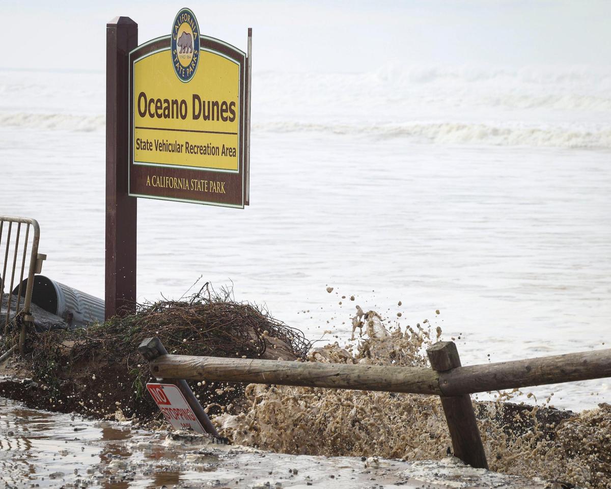 Storm driven high swells on the ocean combined with seasonal high tides combined to cause coastal erosion and water rescues Dec. 28, 2023. The sign for the Oceano Dunes SVRA was undermined at Pier Ave.