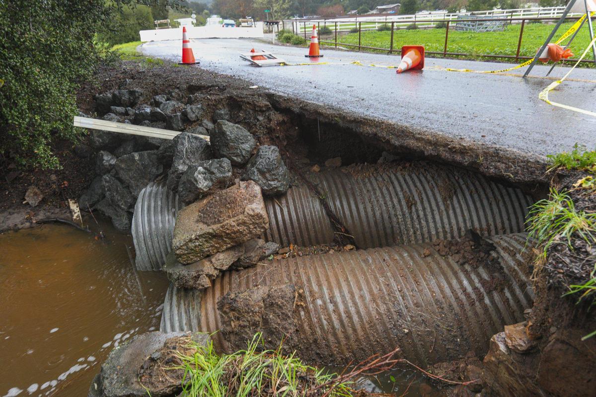 Corbett Canyon Road is closed between Tiffany Ranch Road and Dairy Lane. The road was undermined by stormwater and only the pavement is holding over several feet of air gap above the culvert. Storm updates Jan 16, 2023, as a series of atmospheric river storms hit the coast.