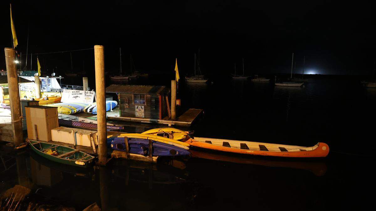 A kayak rests in Morro Bay harbor in the early morning hours of July 30, 2025. Coastal areas of San Luis Obispo County were under a tsunami advisory after an earthquake in Russia.