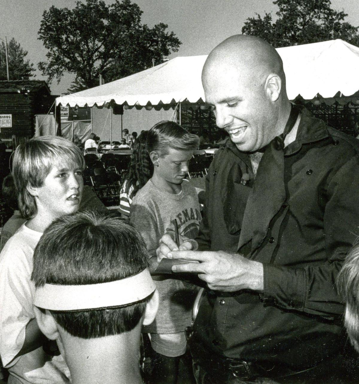 John Grantham signs autographs for fans after recent stunt performance at the Mid-State Fair.