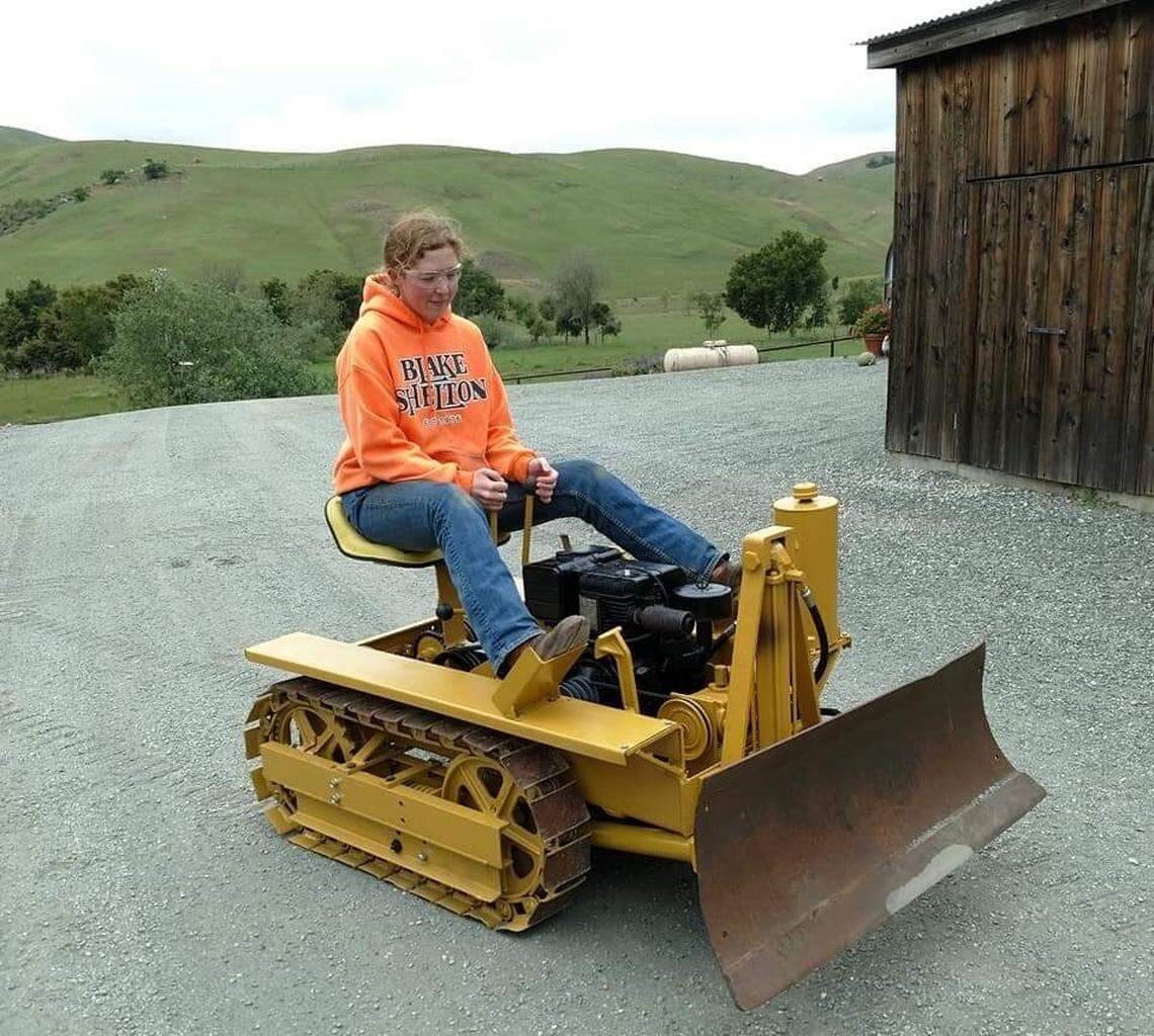 Mackay Langley, a 17-year-old Templeton High junior, takes a victory lap in her restored 1950s-era Agricat dozer after putting in more than 300 hours of work into the project.